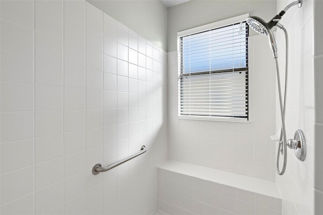 bathroom with a tile shower