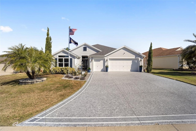 view of front of house featuring a front lawn and a garage