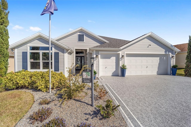 ranch-style home featuring a garage