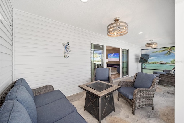 interior space featuring an outdoor living space with a fire pit