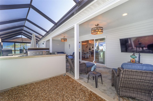 view of patio / terrace featuring area for grilling and glass enclosure