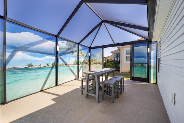 sunroom featuring a swimming pool and lofted ceiling