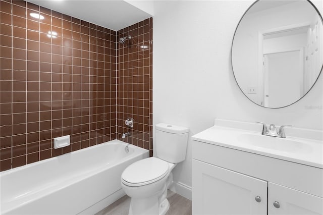 full bathroom with toilet, vanity, hardwood / wood-style floors, and tiled shower / bath