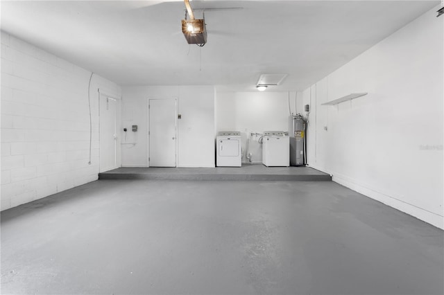 garage with washer and dryer, electric water heater, and a garage door opener