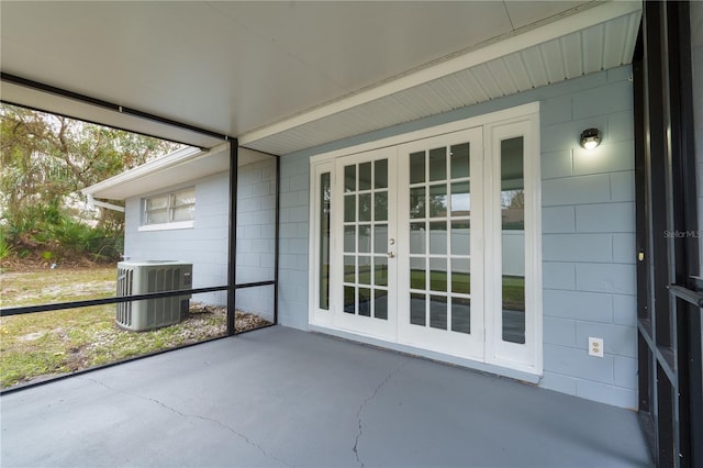 unfurnished sunroom featuring french doors