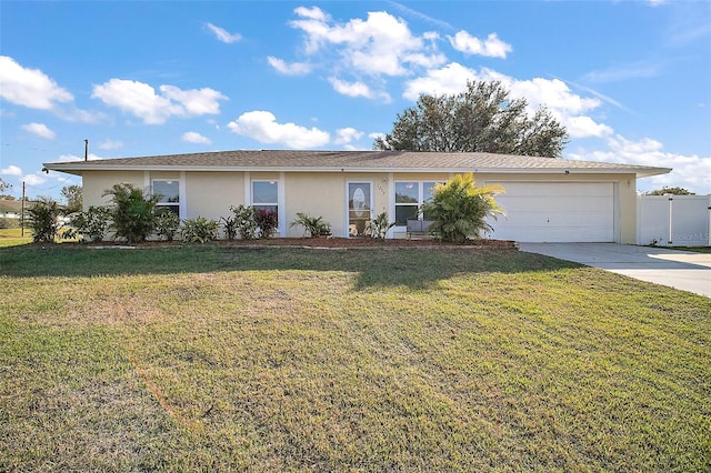 ranch-style home with a garage and a front lawn