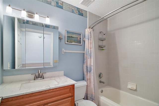 full bathroom with vanity, shower / bath combo, a textured ceiling, and toilet