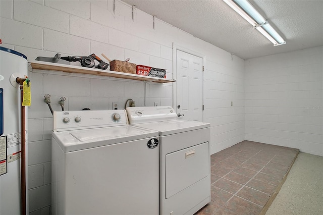 laundry area with independent washer and dryer, a textured ceiling, and water heater