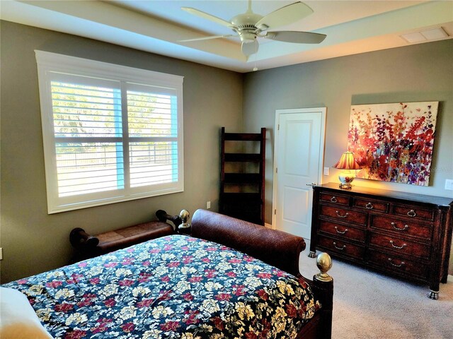 bedroom featuring ceiling fan and light colored carpet