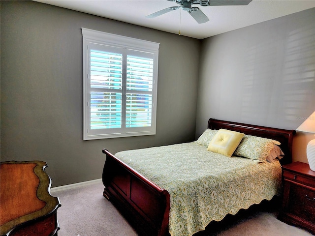 bedroom with ceiling fan and light colored carpet