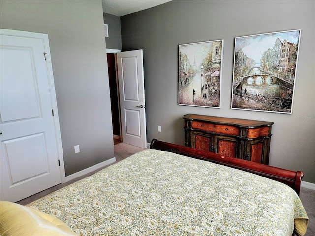 bedroom featuring light colored carpet