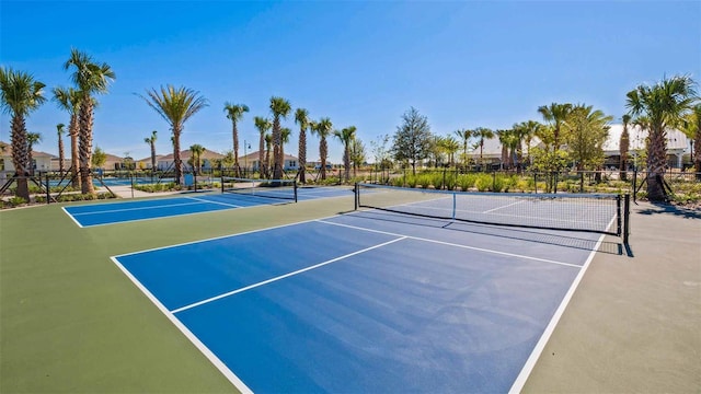 view of sport court with basketball hoop