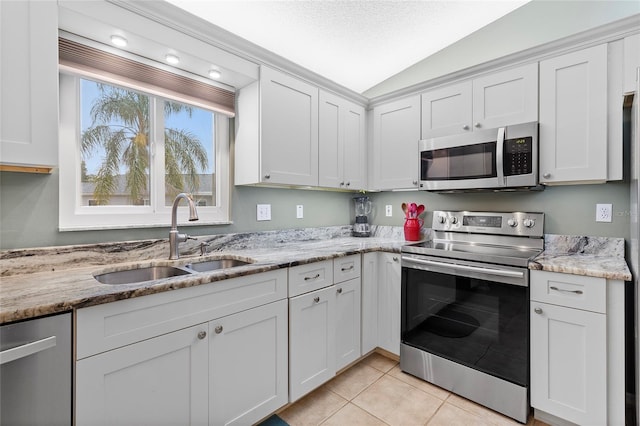 kitchen featuring sink, white cabinets, and stainless steel appliances