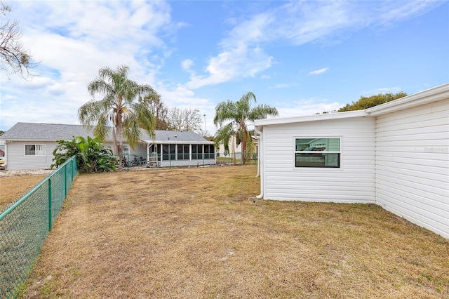 view of yard featuring a sunroom