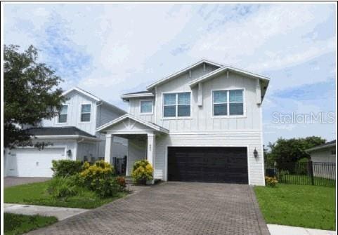 view of front facade with a front yard and a garage