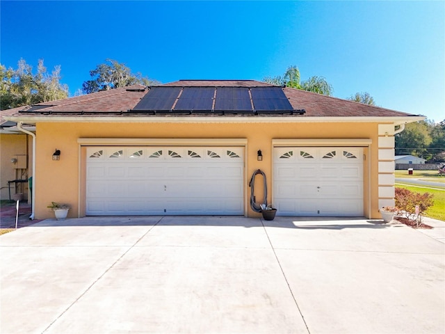 garage featuring solar panels