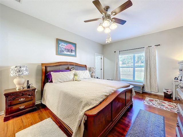 bedroom featuring dark hardwood / wood-style floors and ceiling fan