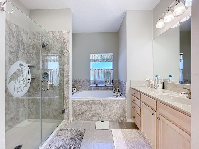 bathroom featuring tile patterned flooring, vanity, and separate shower and tub