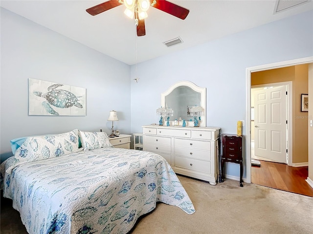 carpeted bedroom with ceiling fan