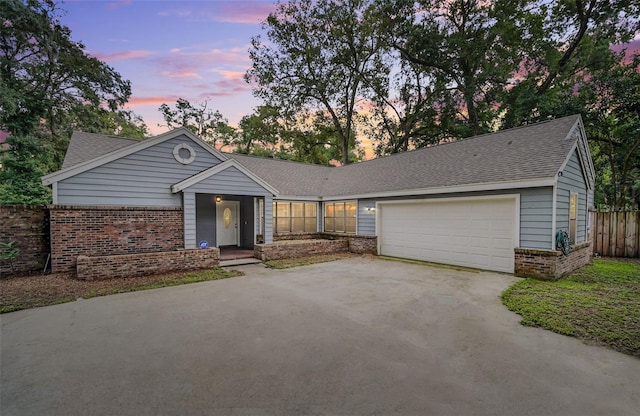 single story home with a garage