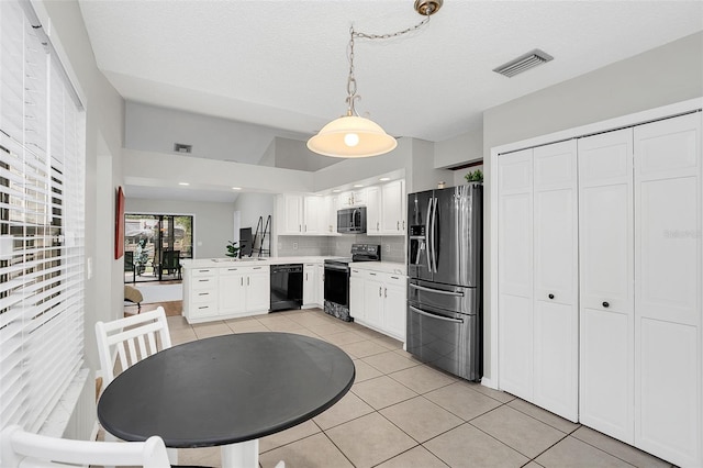 kitchen with pendant lighting, black appliances, light tile patterned floors, tasteful backsplash, and white cabinetry