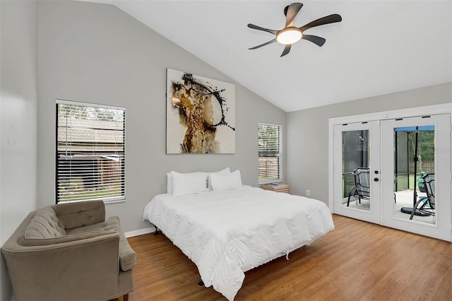 bedroom featuring access to exterior, ceiling fan, french doors, lofted ceiling, and hardwood / wood-style flooring