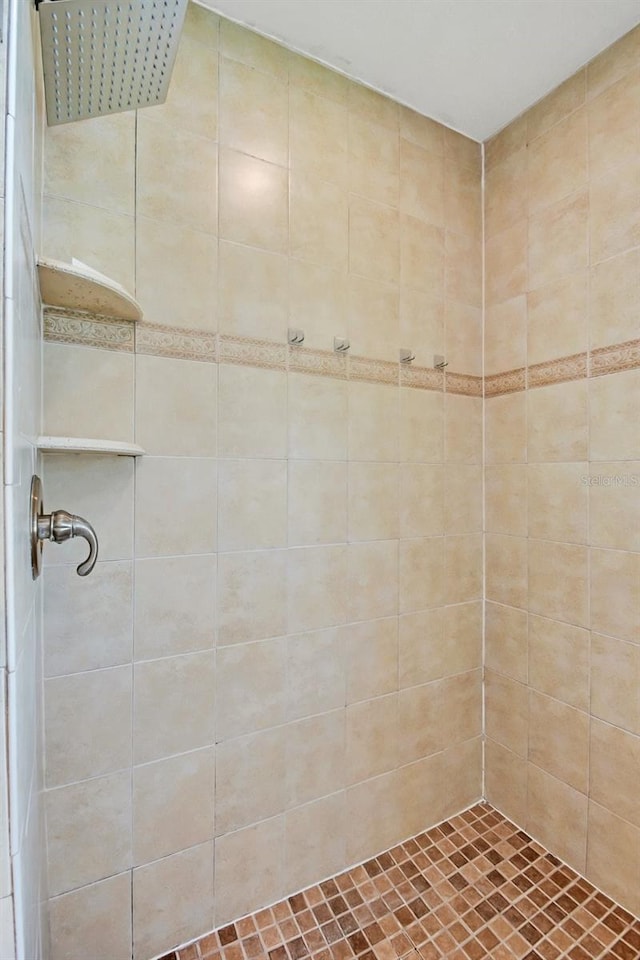 bathroom with a tile shower