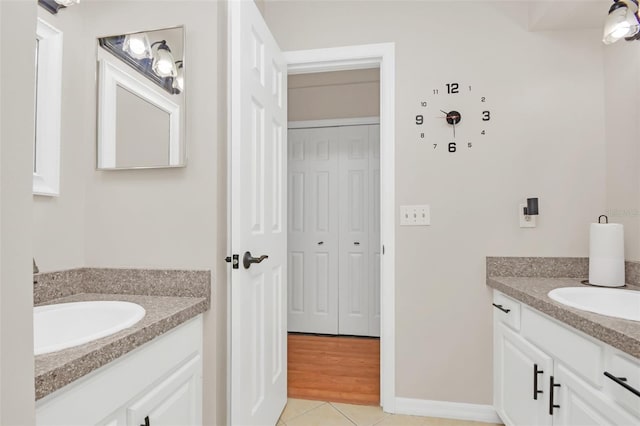 bathroom featuring tile patterned flooring and vanity