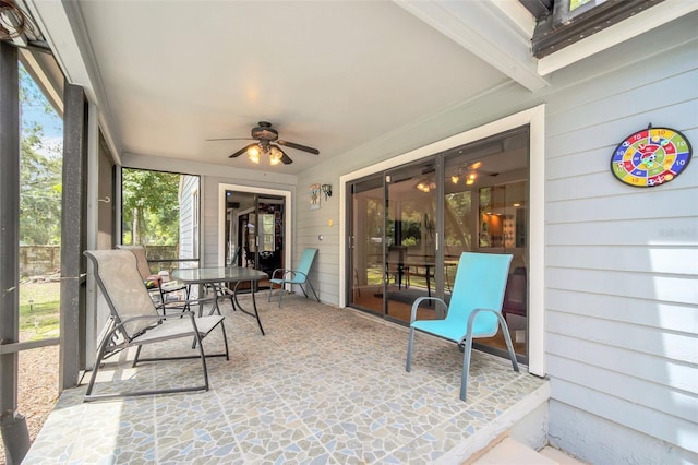 sunroom / solarium with ceiling fan