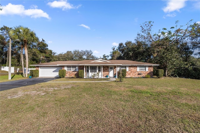 ranch-style house with a garage and a front yard