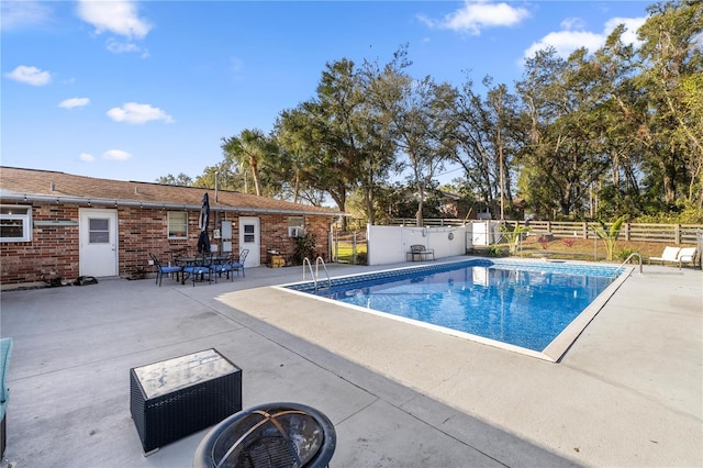 view of swimming pool featuring a patio