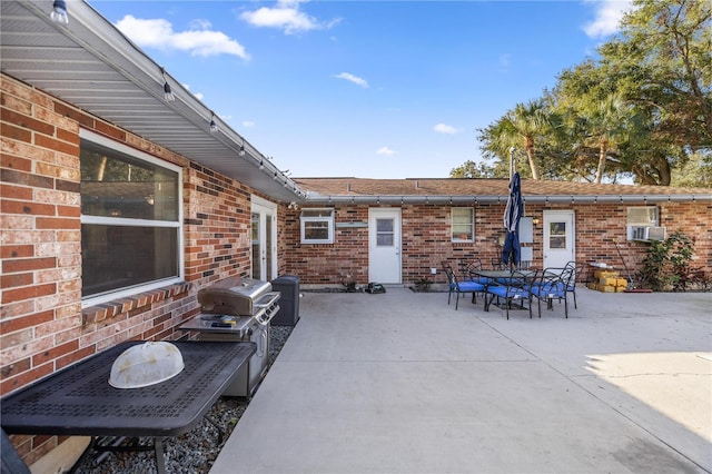 view of patio with grilling area and cooling unit