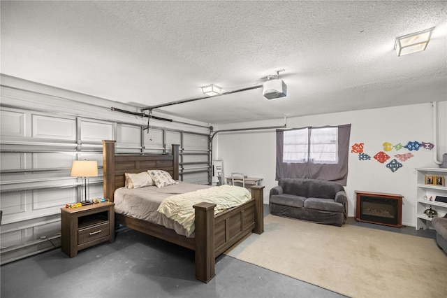 bedroom featuring concrete flooring and a textured ceiling