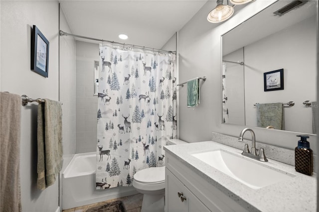 full bathroom featuring vanity, shower / tub combo, and toilet