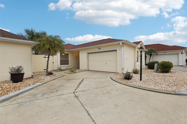 ranch-style home featuring a garage