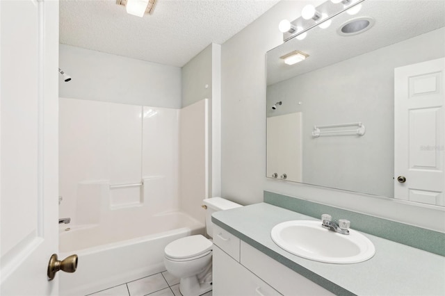 full bathroom featuring vanity, a textured ceiling, toilet, tile patterned floors, and shower / washtub combination