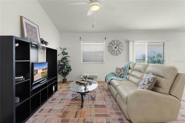 living room with a wealth of natural light and ceiling fan