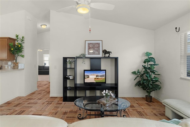 living room featuring light parquet floors, vaulted ceiling, a wealth of natural light, and ceiling fan