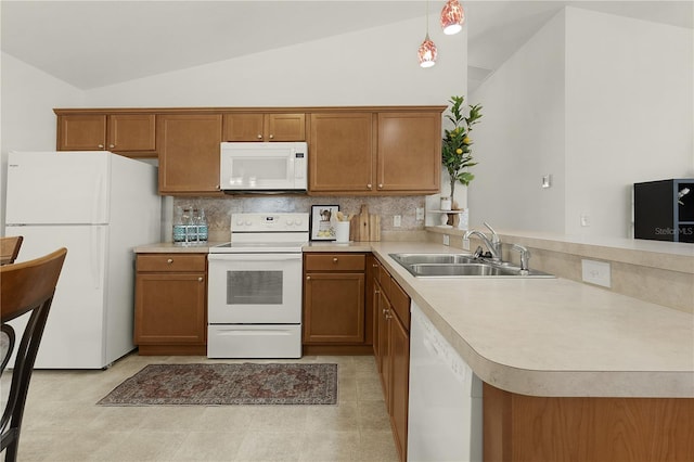 kitchen with vaulted ceiling, kitchen peninsula, pendant lighting, and white appliances