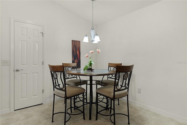 dining room featuring lofted ceiling and a chandelier