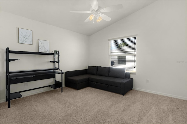 carpeted living room featuring ceiling fan and lofted ceiling