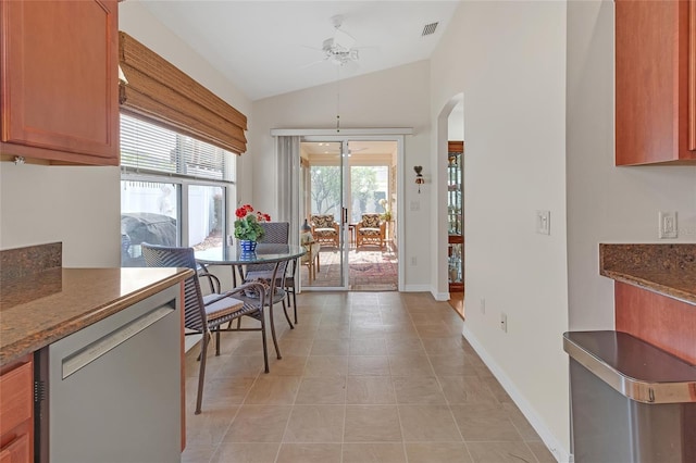 dining area featuring ceiling fan and vaulted ceiling