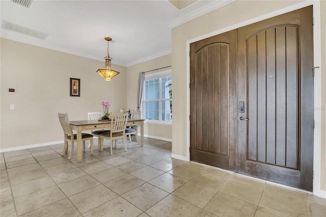 entrance foyer featuring ornamental molding