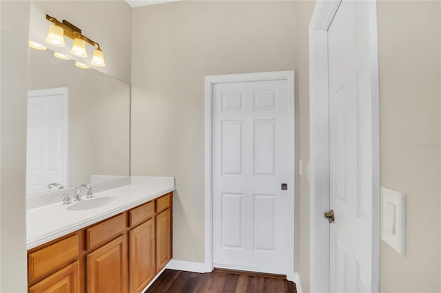 bathroom featuring hardwood / wood-style floors and vanity