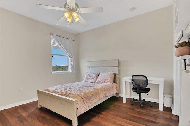 bedroom with ceiling fan and dark hardwood / wood-style floors