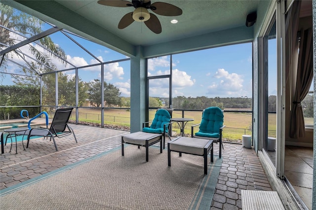 sunroom with ceiling fan and a healthy amount of sunlight