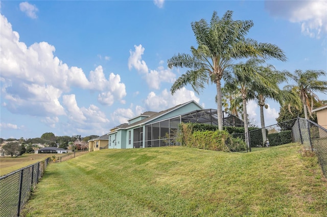 view of yard featuring glass enclosure