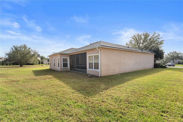 view of side of property featuring a yard