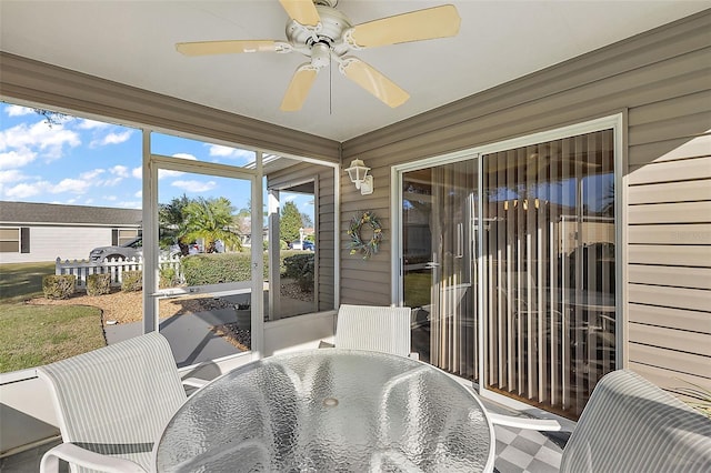 sunroom / solarium featuring ceiling fan