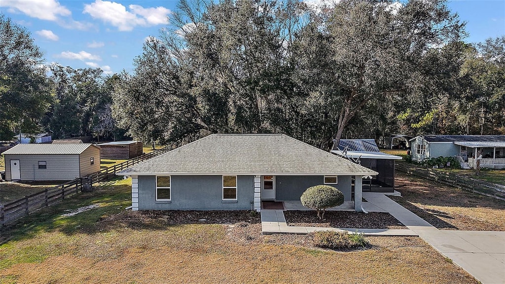 ranch-style home with a front lawn